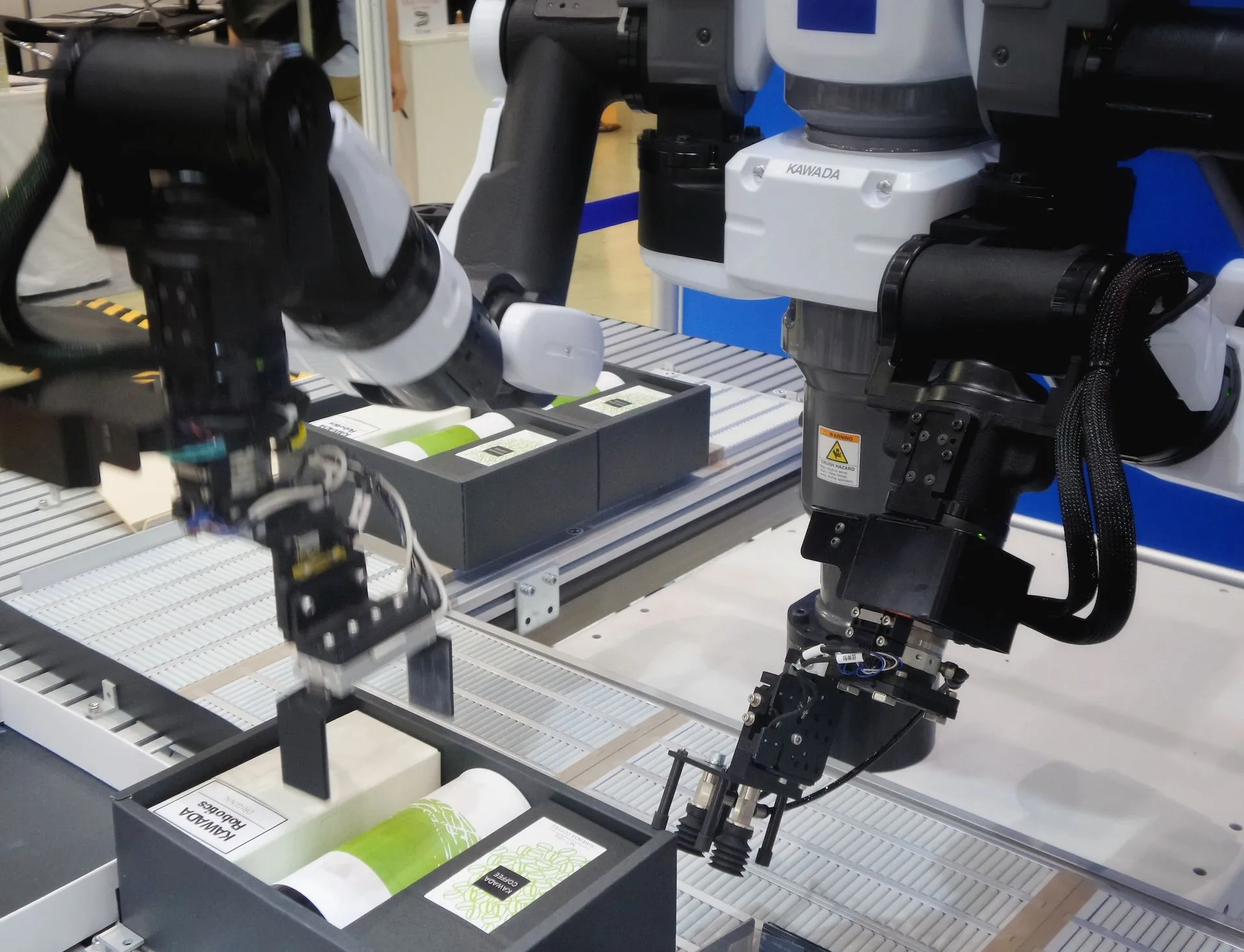 Industrial robotic arms on an automated line